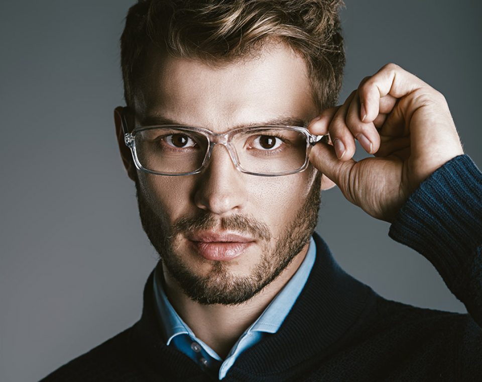Elegant man in glasses. Optics style for men. Handsome businessman in spectacles. Male beauty, fashion.